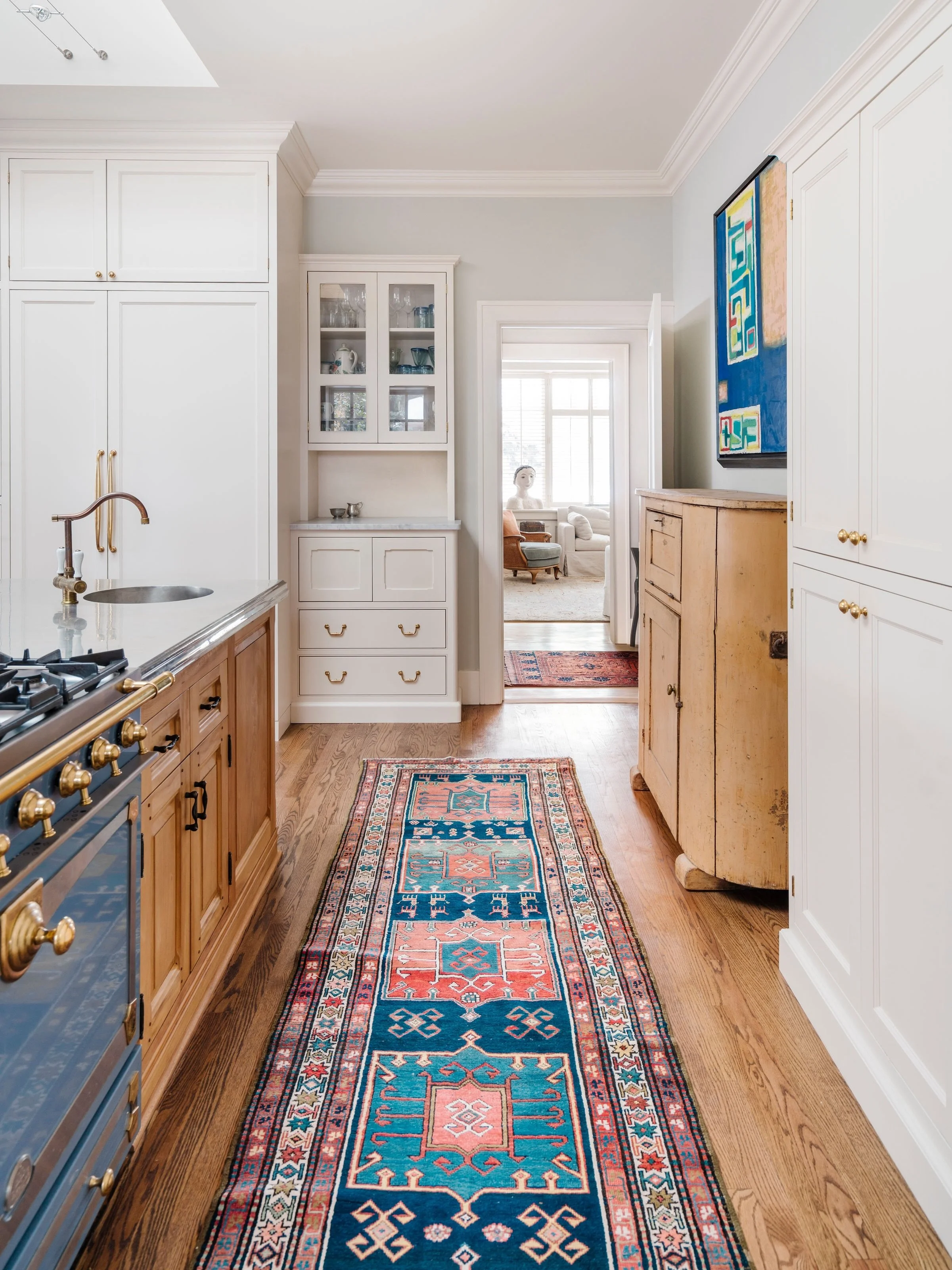 What I love about this kitchen was the clients intention on having this space feel more in sync with the adjoining sitting room. By hanging her Marion Nichol painting in the kitchen, placing antiques amongst our built in cabinetry and allowing a gorg