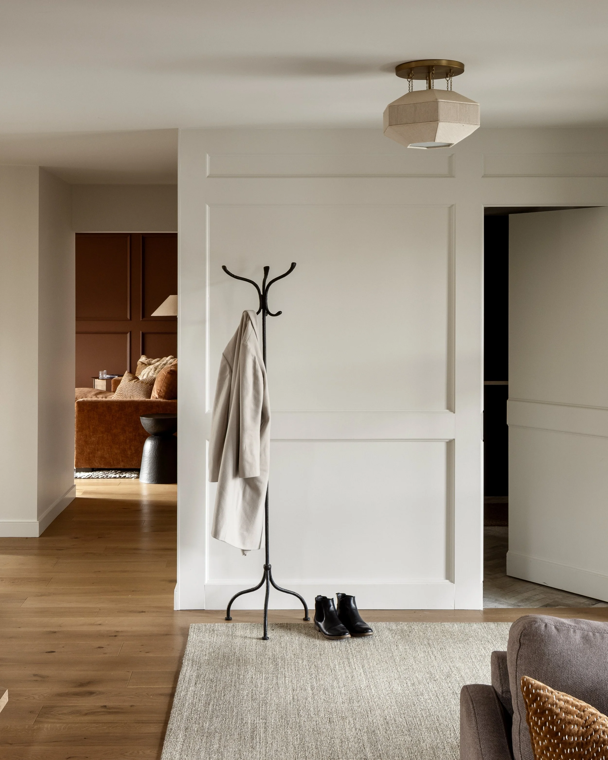 A welcoming foyer of simple sophistication at first glance gives way to a secret passageway to a resilient mudroom for three boys, their boots and backpacks to unload after busy school days. 
Photo @eymeric.widling 
Contractor @hunterhomes.ca 
#homer