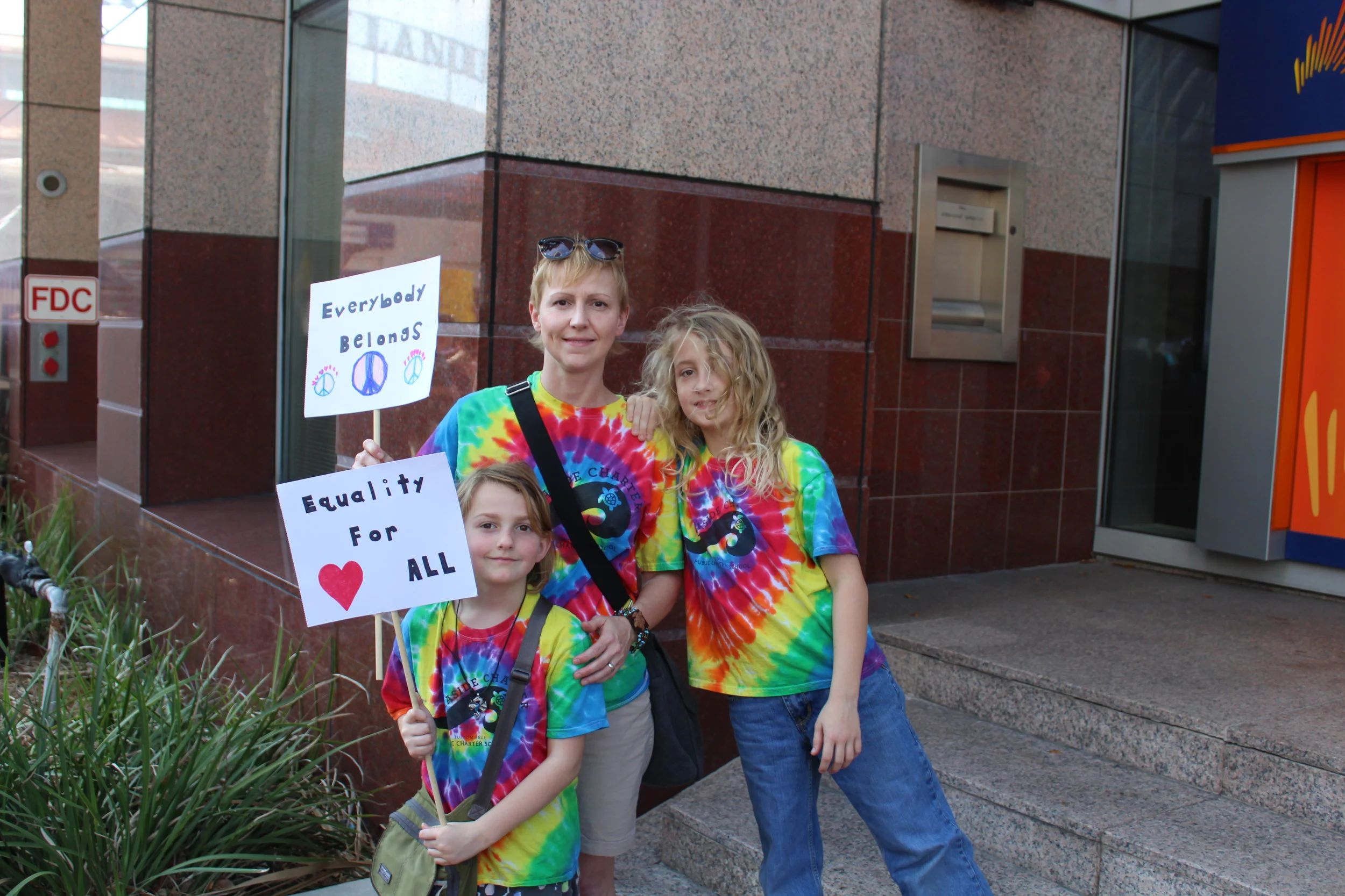 From left, Isla, Nicole and Finn Flaherty at the march on Saturday.
