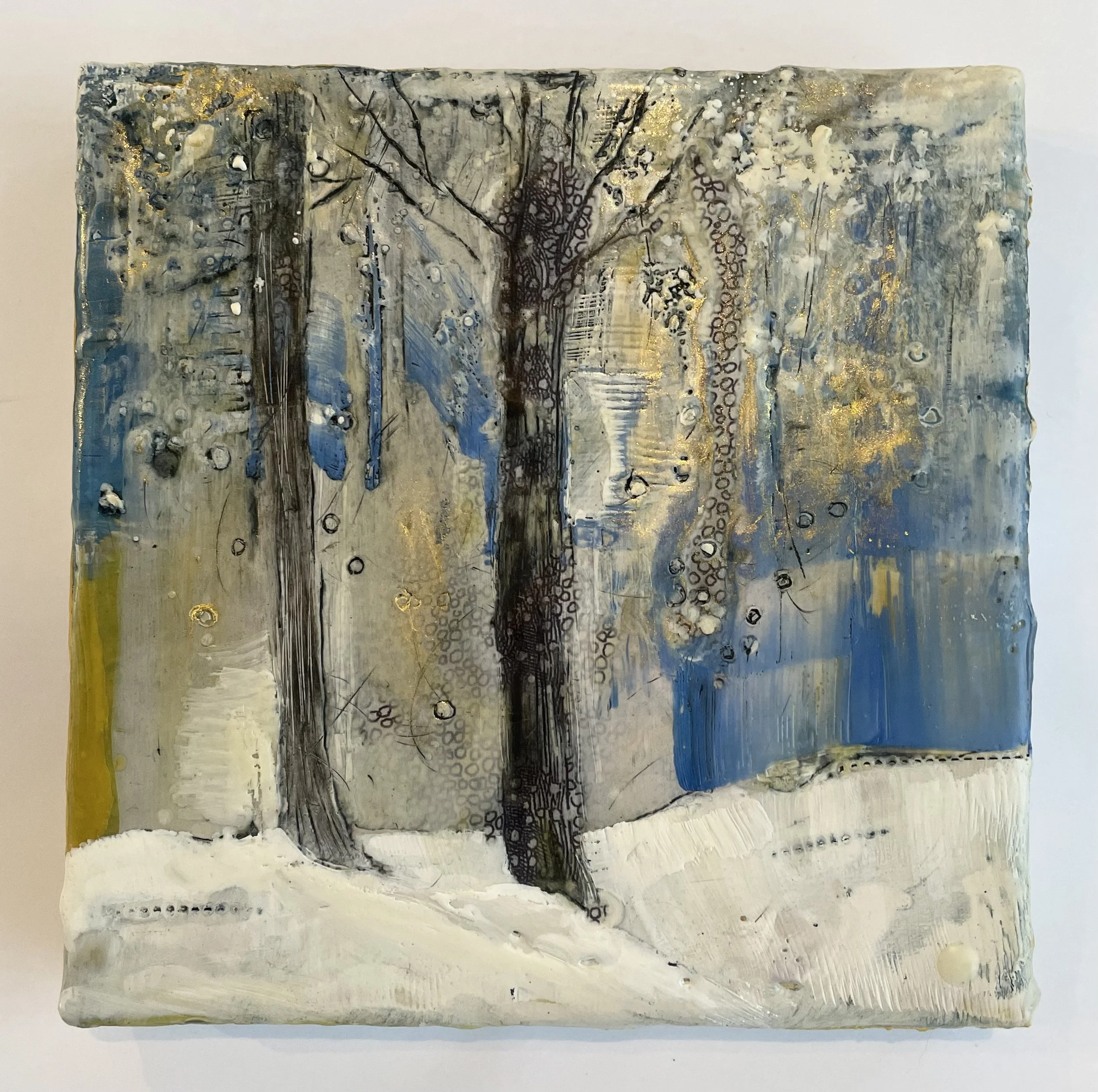 Snow and Two Tree Trunks