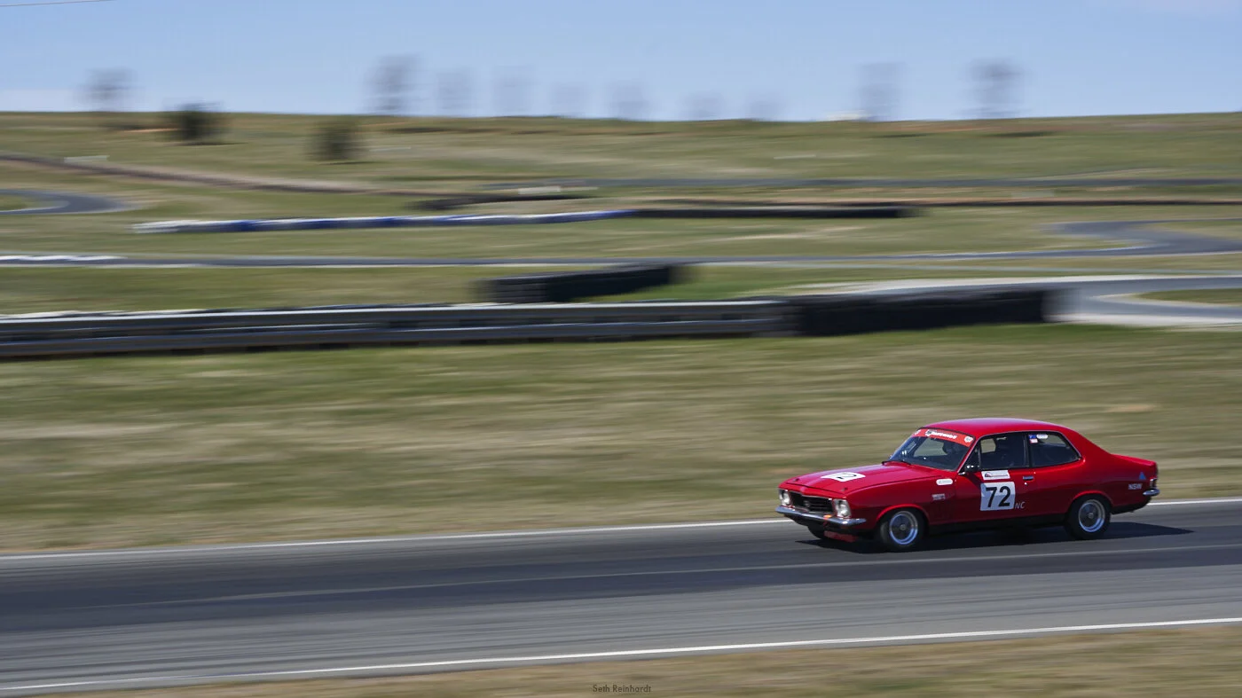 Paul Tierney pushing the Torana through turn one.