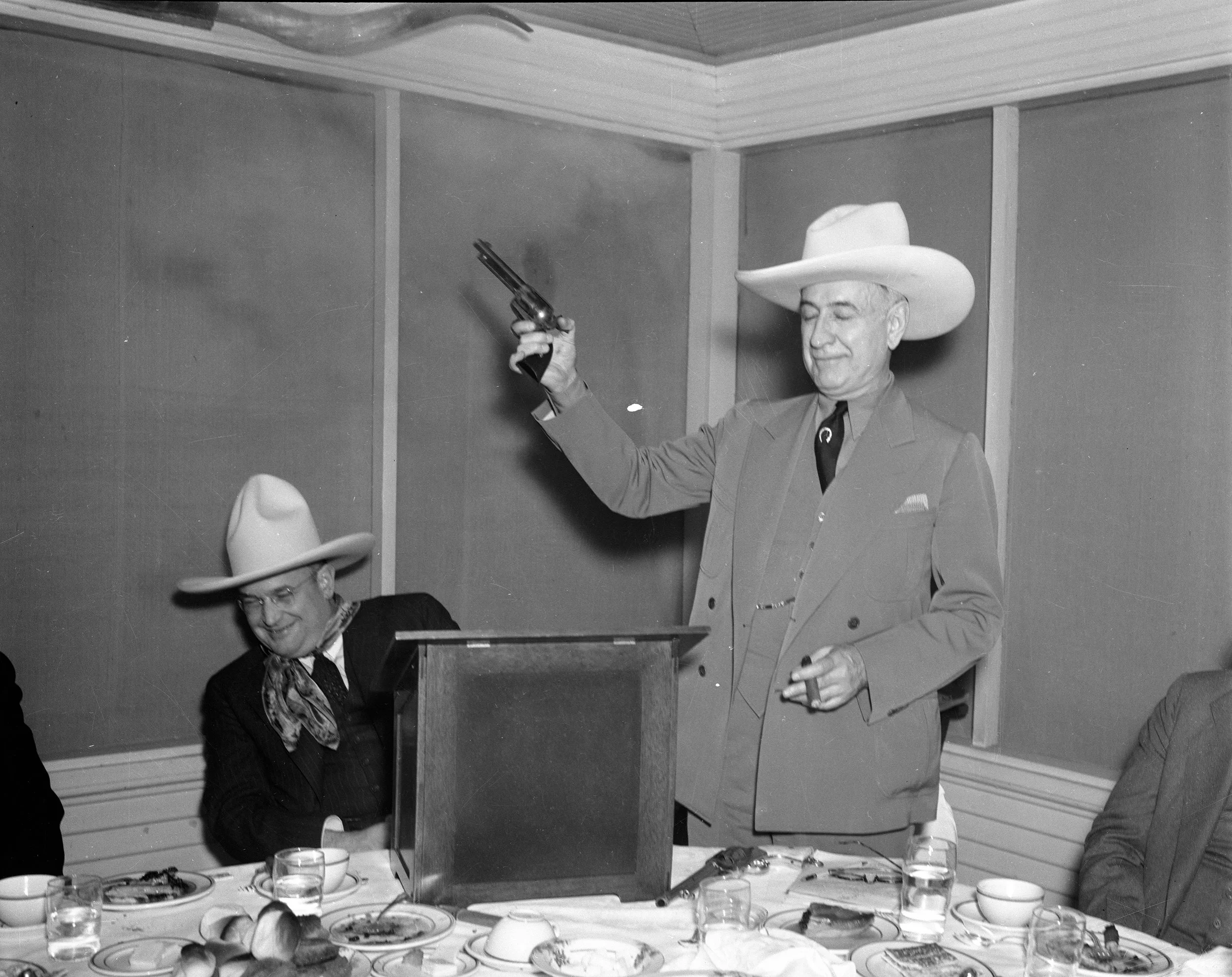 waving gun at his house 10010642.jpg