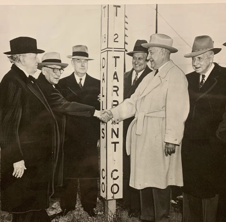 Amon Carter, in the light-colored coat, did not fancy stepping across the county line, if he didn’t have to.