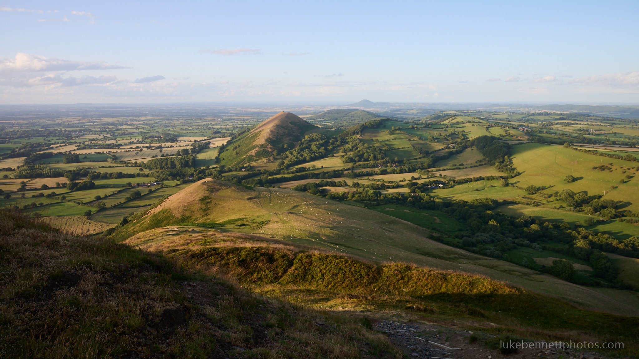  The view from the top of Caer Caradoc, looking over towards the Lawley, with the Wrekin in the far background 