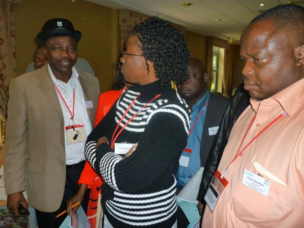 left to right foreground, dick irri, nigeria, lydia magama, botswana and peter shewiyo, tanzania, at the psychometric workshop.