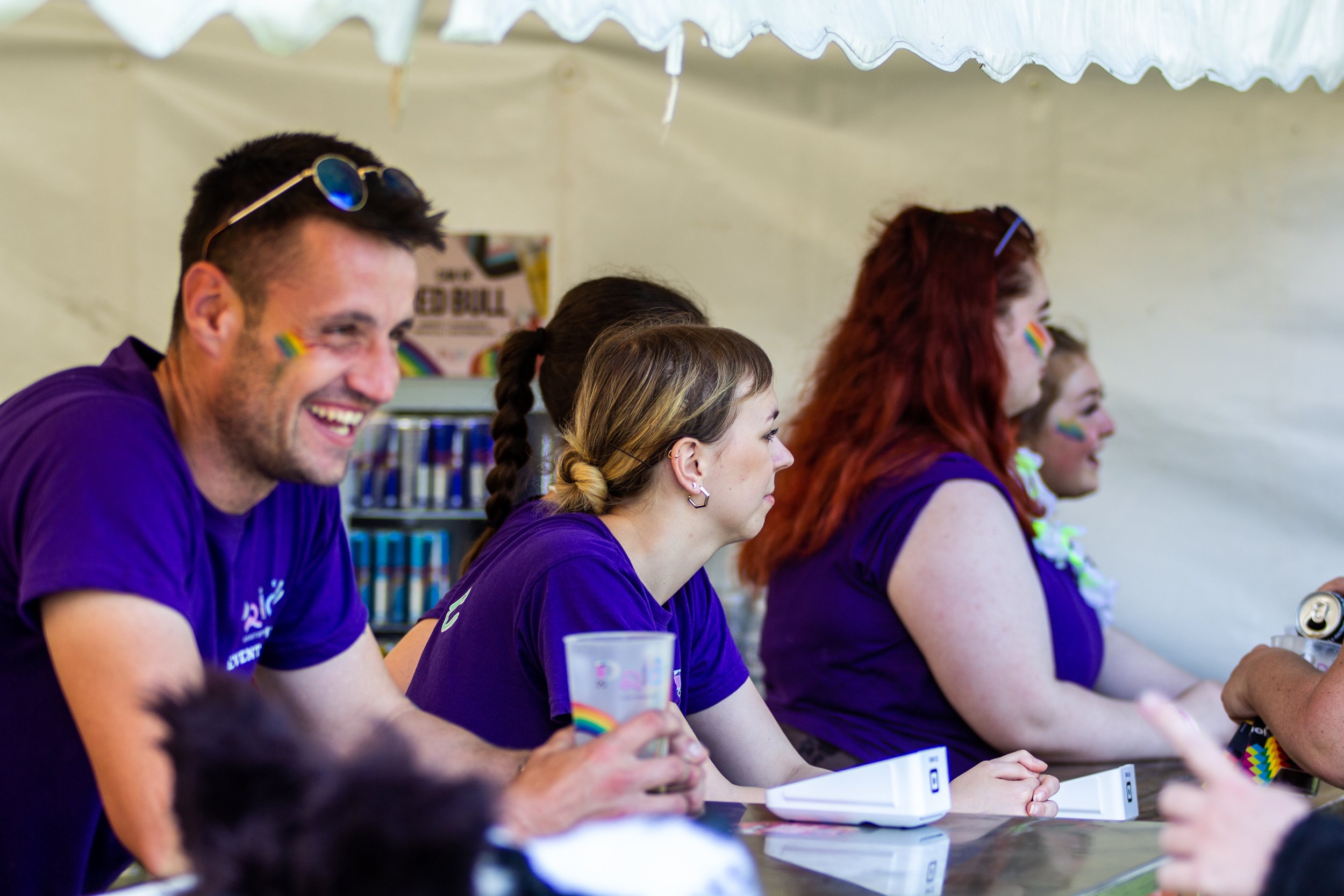 Photo of the pride team running one of the bars.