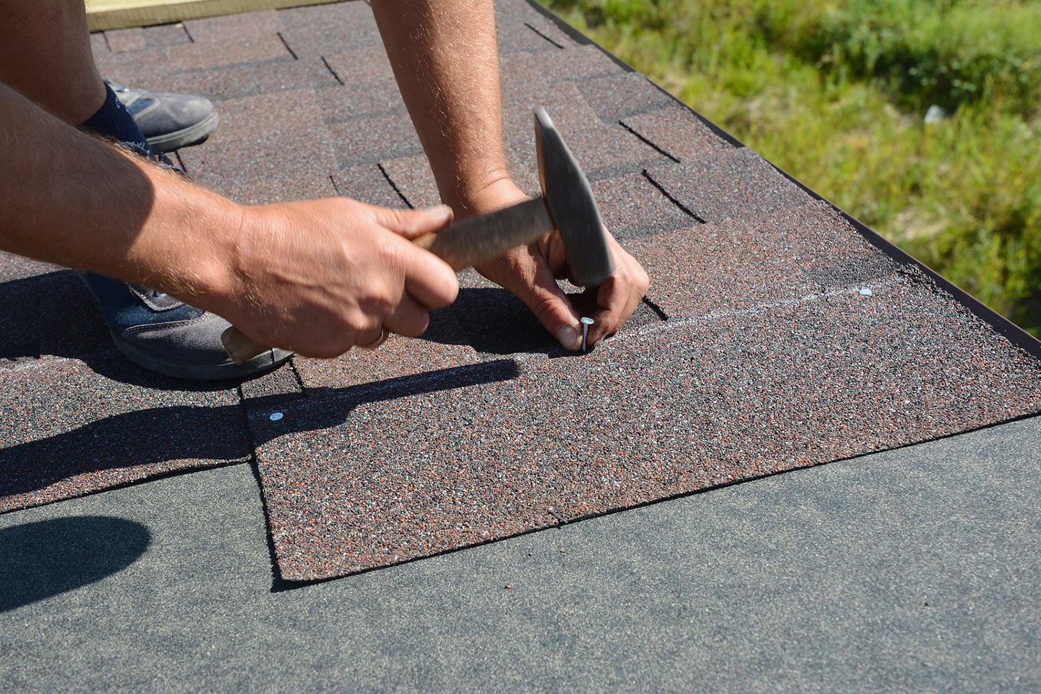Home-bigstock-Roofer-Installing-Asphalt-Shin-268266898.jpg
