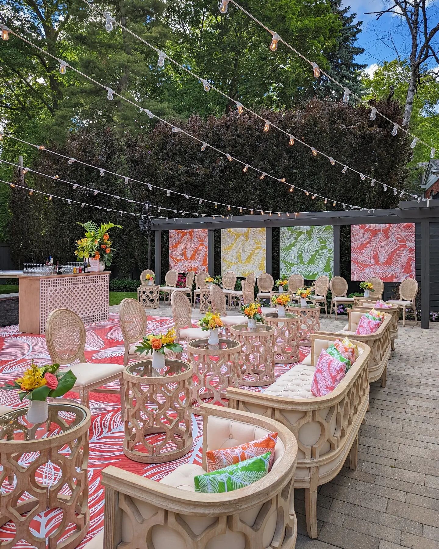 Tonight's birthday celebration is a backyard transformation of vibrant colour! Our team created a tropical inspired aesthetic using limewashed furnishings, bold prints, and minimalist floral treatments. The entire design was installed over an existin