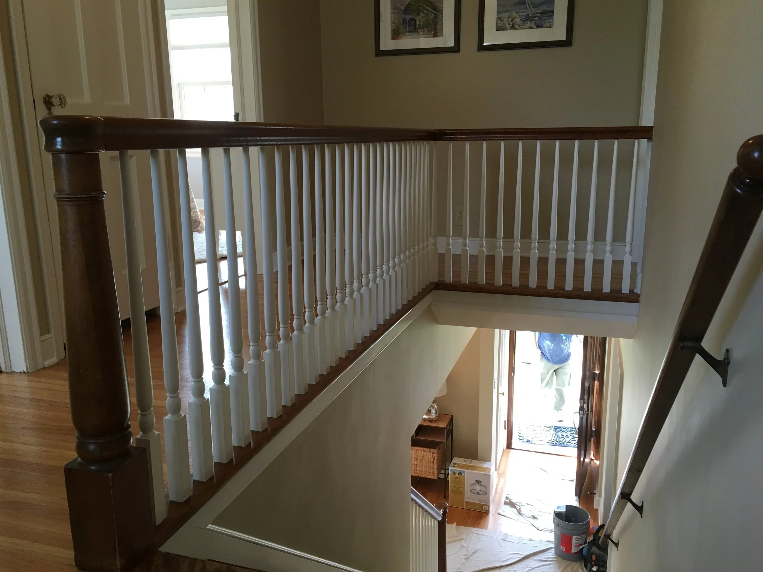  Enameled doors, trim and spindles brightened the upstairs landing.  