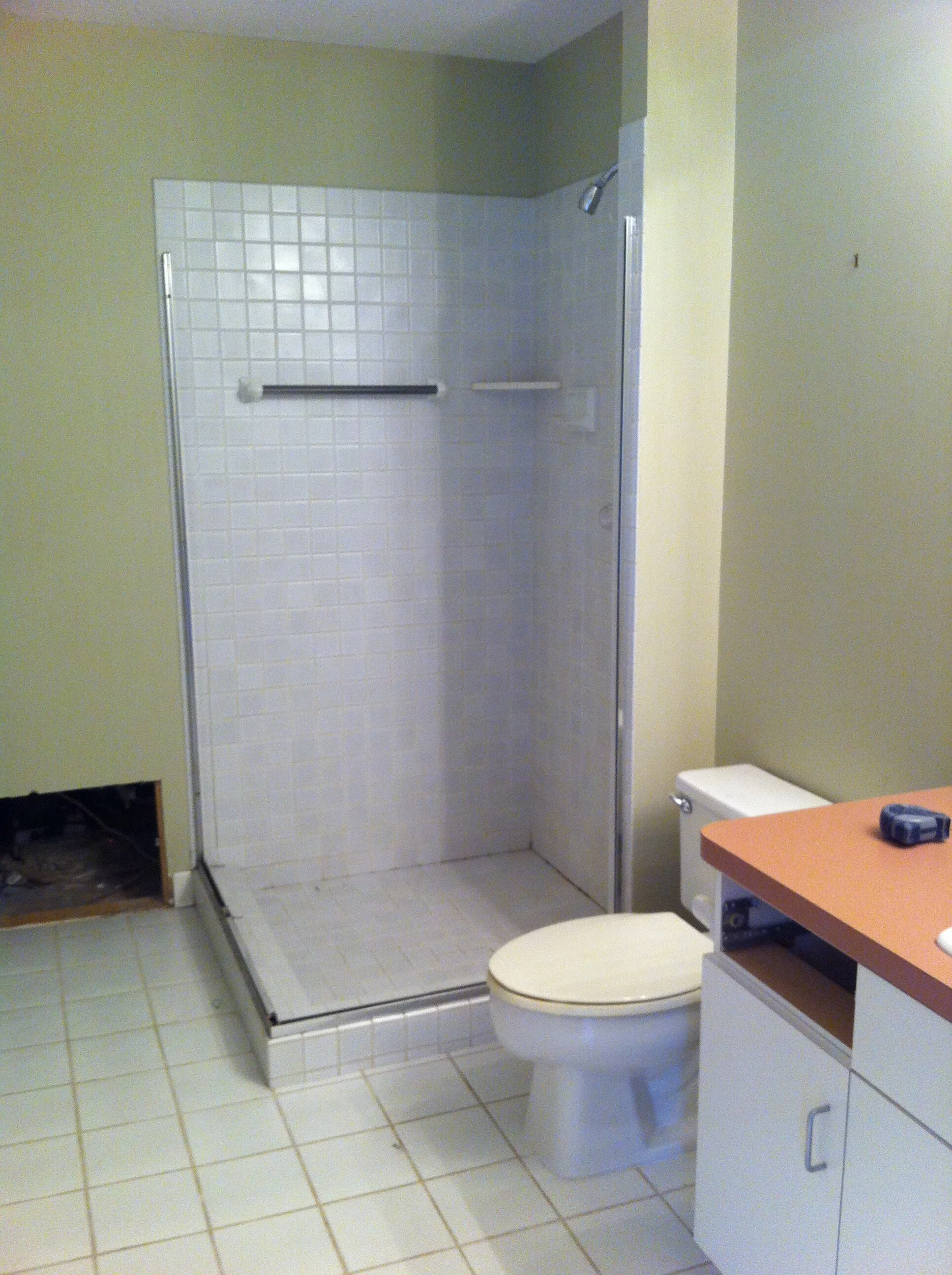  Old tile and grout were in rough shape,  as was the glass enclosure (not shown). 