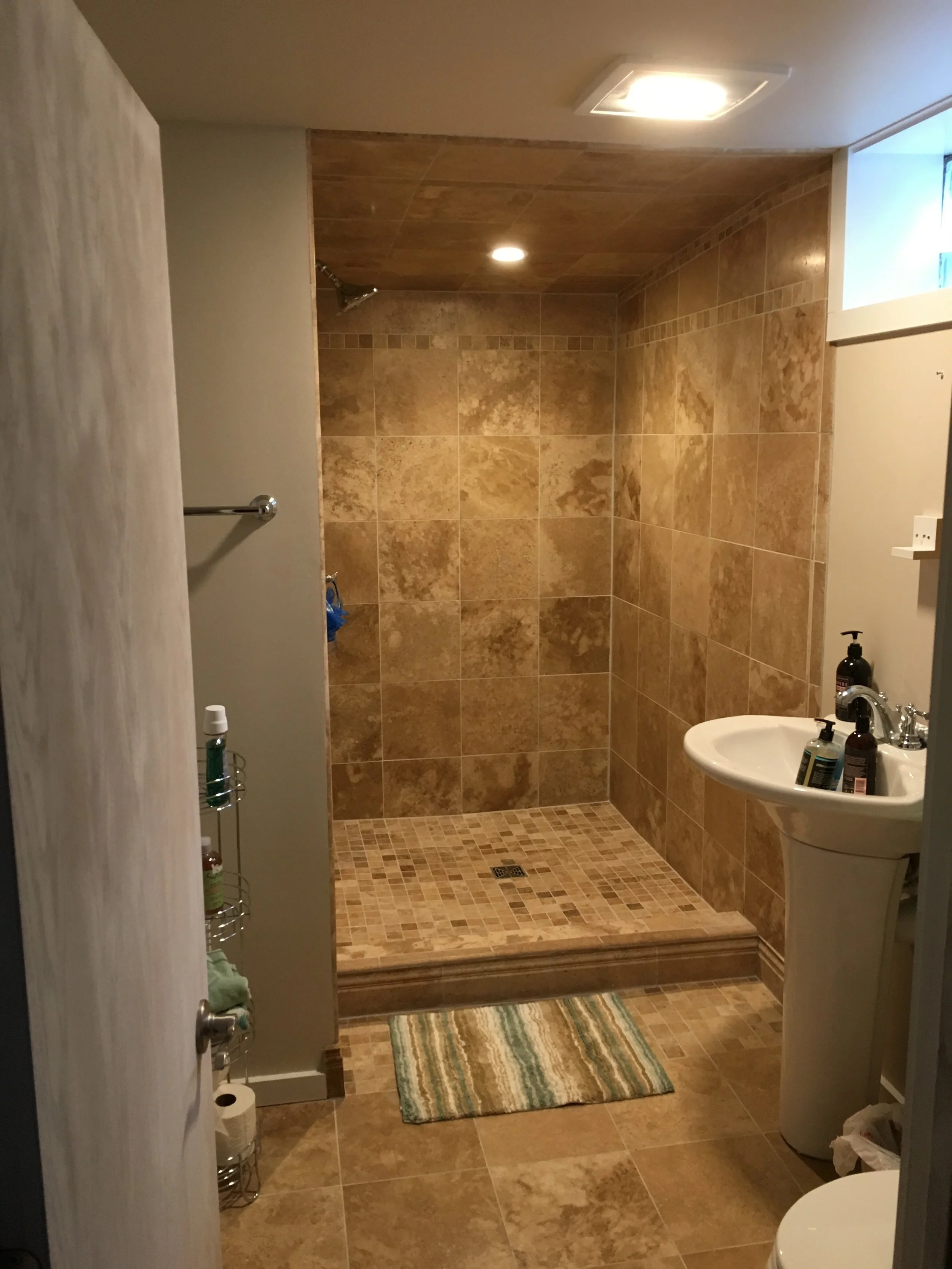  From bare studs to beautiful basement bathroom. 