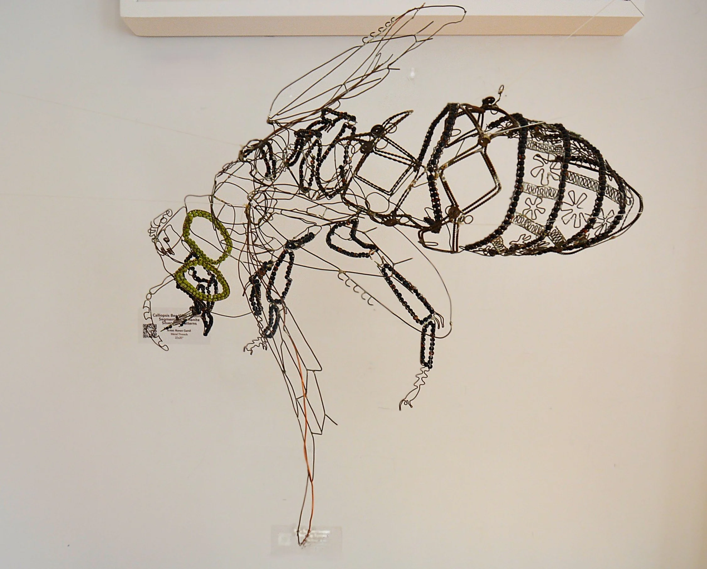   Bee Miner   2023 copper wire, copper beads, glass beads  7 x 15-¾ x 24-½ inches&nbsp; (H W D)  The Artists Garden, Harlem (2023), Gallery Particulier, Brooklyn (2025)  This mining bee sculpture reflects several personal identity facets: these inclu