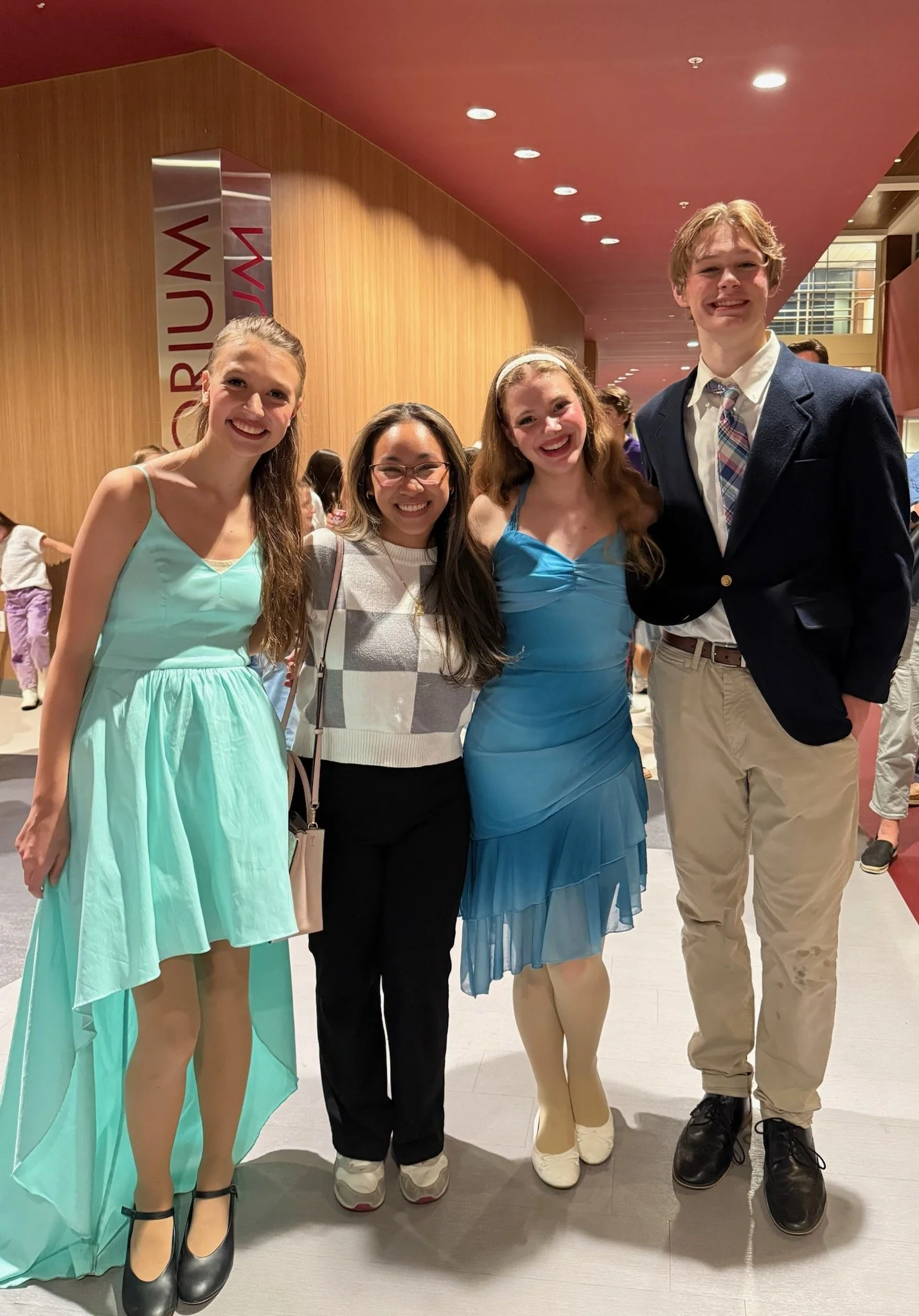 Ms Katie supporting her vocal students at their High School Musical Production