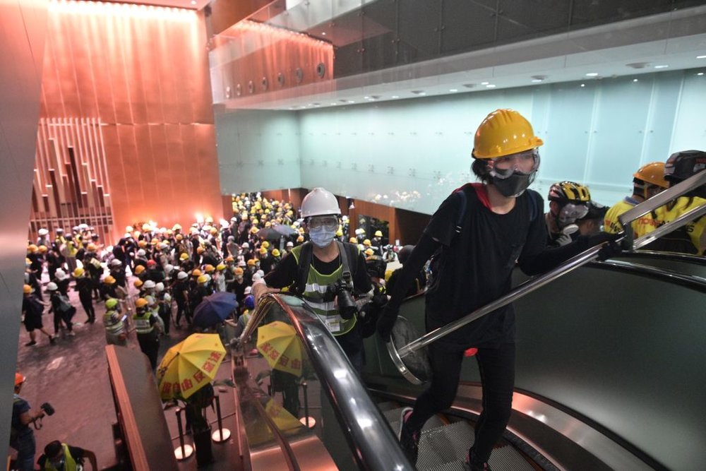  Protesters break into the government headquarters in Hong Kong on July 1, 2019, on the 22nd anniversary of the city’s handover from Britain to China after successfully smashing their way through reinforced glass windows. Photo: ANTHONY WALLACE/AFP/G