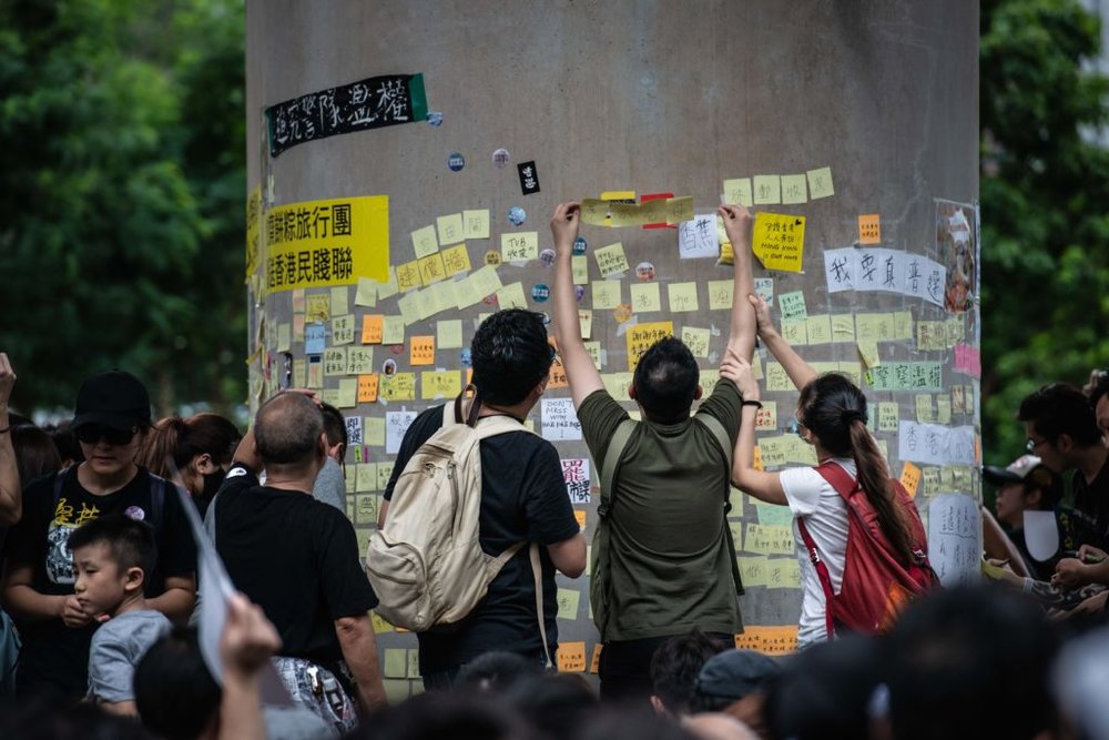  Demonstrators leave messages on sticky notes on a “Lennon wall” during the protests. (Photo by Ivan Abreu/SOPA Images/LightRocket via Getty Images) 