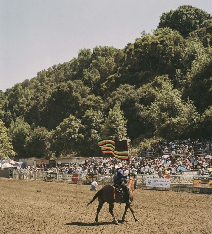  A cowboy at the 2017 BPIR waves a version of the African American flag as he rides around the arena introducing the show. 