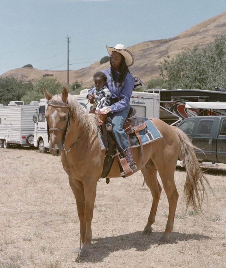  Barrel racing contestant Little Jackie “Speed” Garner and son Jo’Siah Nelson spend time together moments after the Grand Entry at the 2008 BPIR in Oakland. 