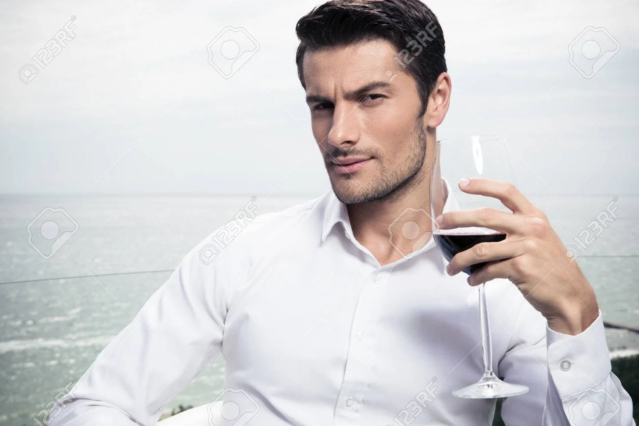 44401443-handsome-young-man-drinking-wine-outdoors.jpg