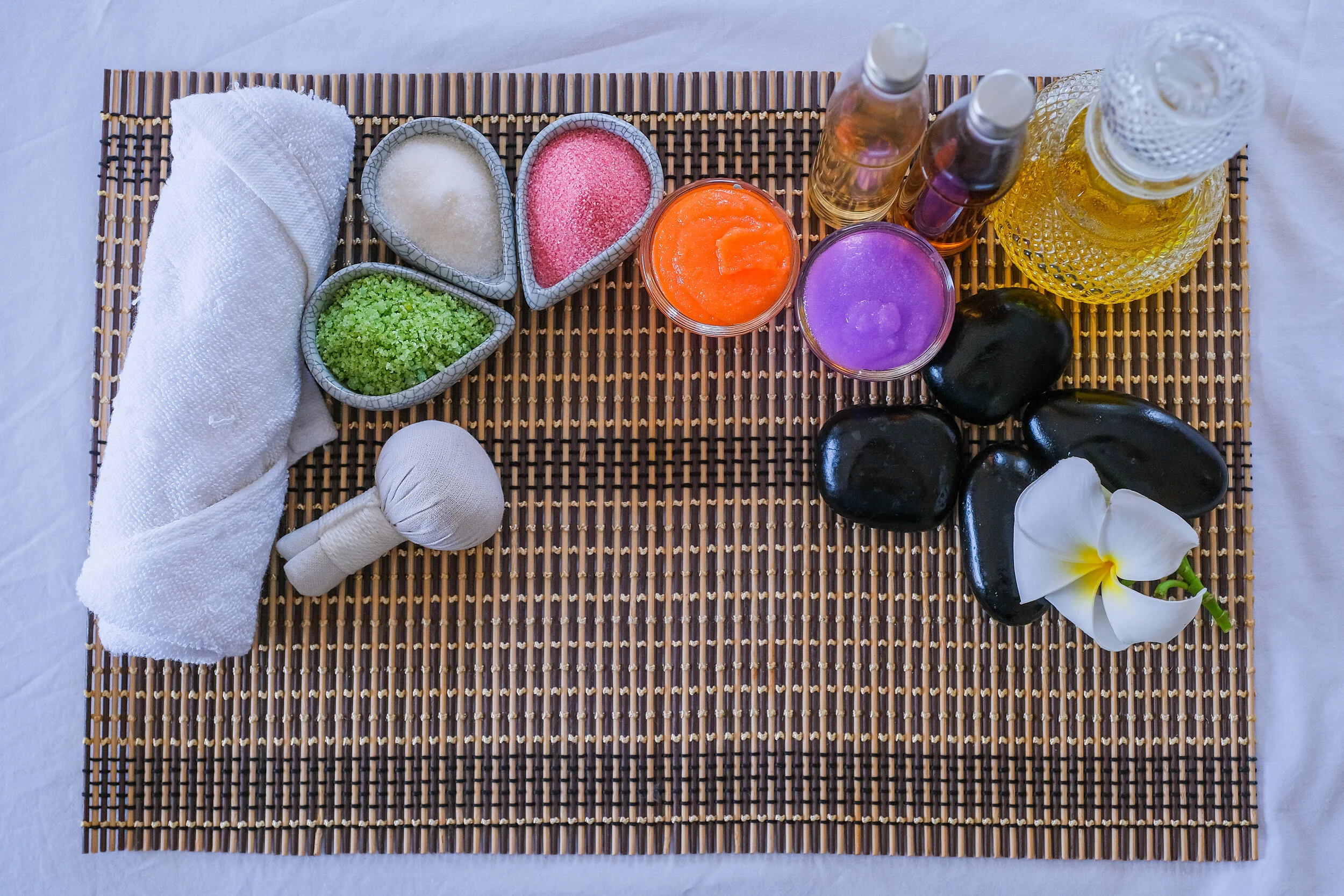 spa-treatment-set-aromatic-massage-oil-bed-massage-thai-setting-aroma-therapy-massage-with-flower-bed-relax-healthy-care.jpg