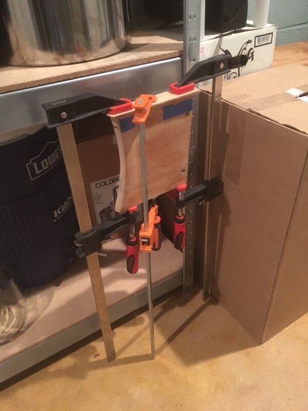 Gluing shim in place; trimmed and leveled.