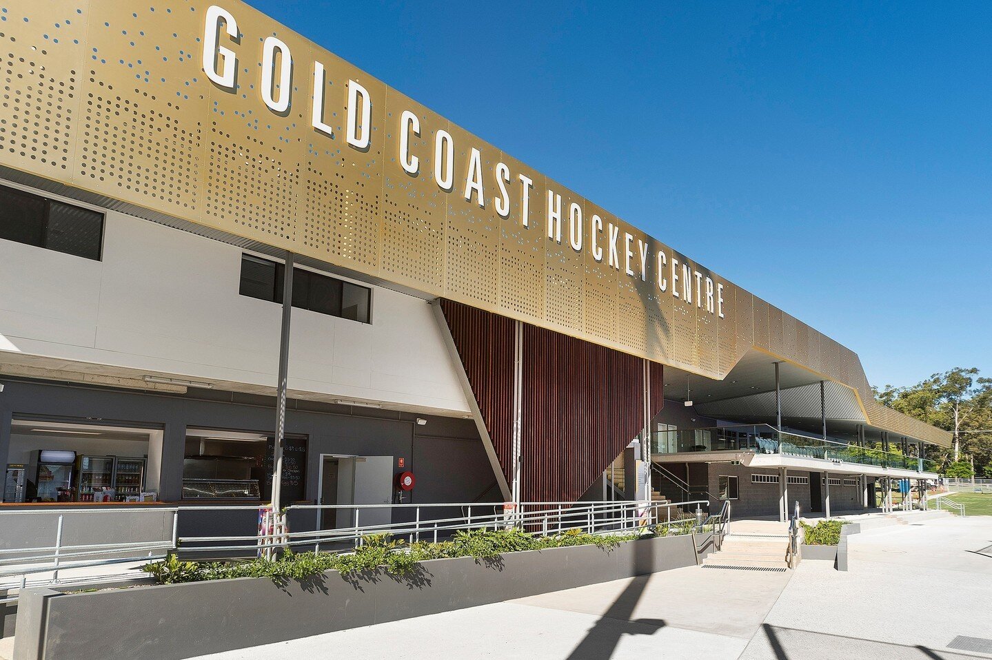 GC Hockey Centre // MODE was engaged to deliver an international standard venue for the Gold Coast 2018 Commonwealth Games. The⁠
centre provides hockey facilities of an international competition and training standard, with two world class synthetic p