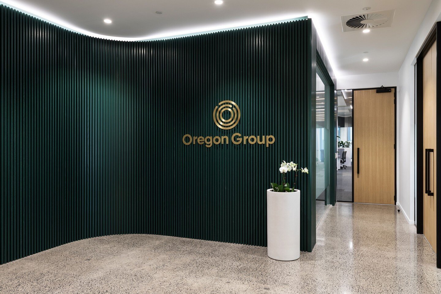 MODE Auckland was commissioned to design a new office fit-out for Oregon Group in Grafton, Auckland. The team implemented bespoke design into this office fit-out which included the construction of a curved green timber batten wall in the reception of