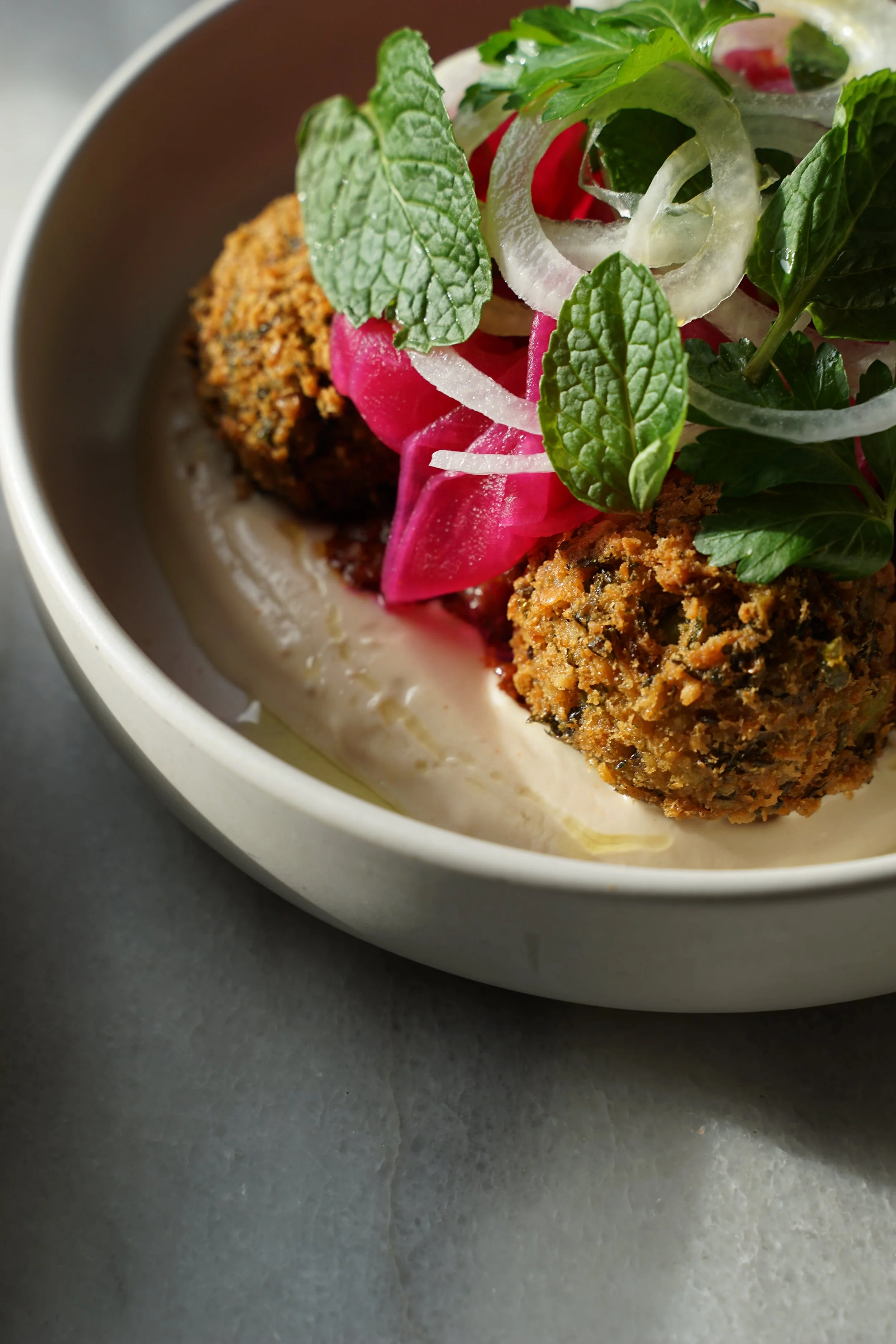  Falafels w. Garlic Yoghurt, Spiced Eggplant, Pickled Daikon, White Onion &amp; Soft Herb Salad. 