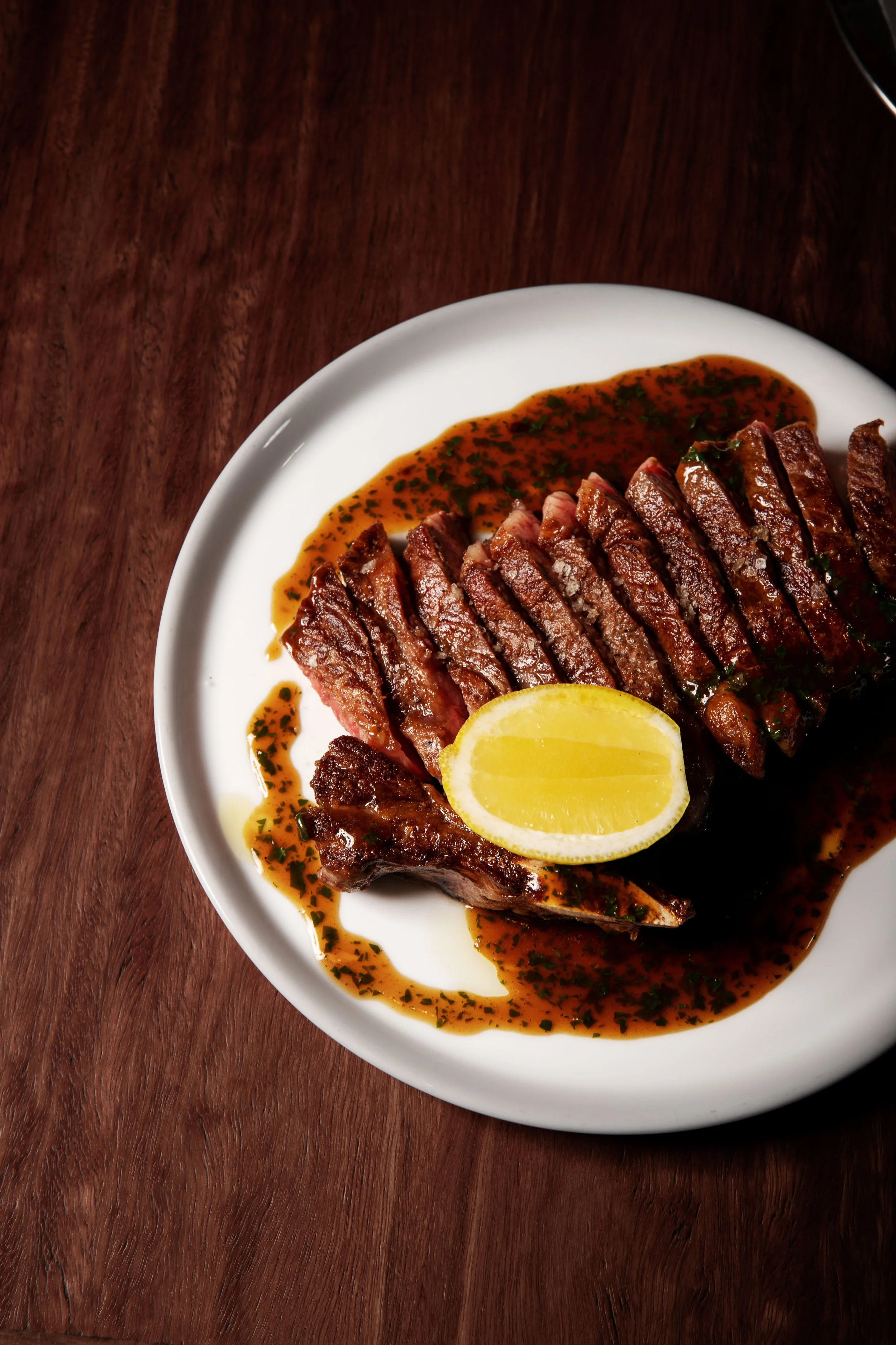  300g or 500g (pictured) Sirloin on the Bone served w. Chicken Jus, Fries &amp; Salad. 