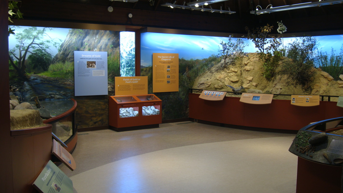 The main exhibit gallery features the Oak Woodlands, Riparian and Chaparral dioramas.