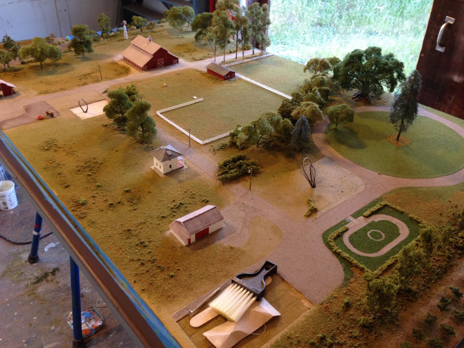 Over 350 hours went into the design and building of this 1:160 scale model. I spent close to a year working on it. The model base measures approximately 3′-6″ by 5′.
