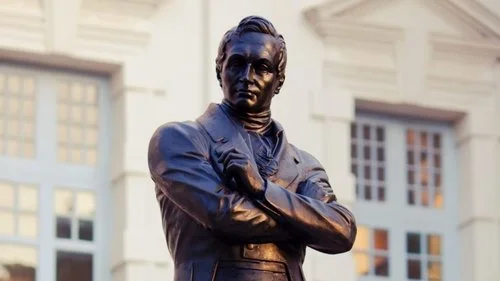Sir Stamford Raffles still surveys the Civic District from his vantage point in front of the Victoria Halls