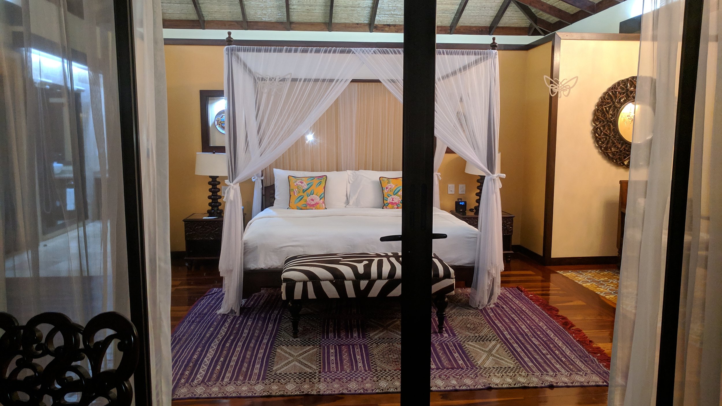 The balcony is straight off in front of the bed and connected through these glass double doors.