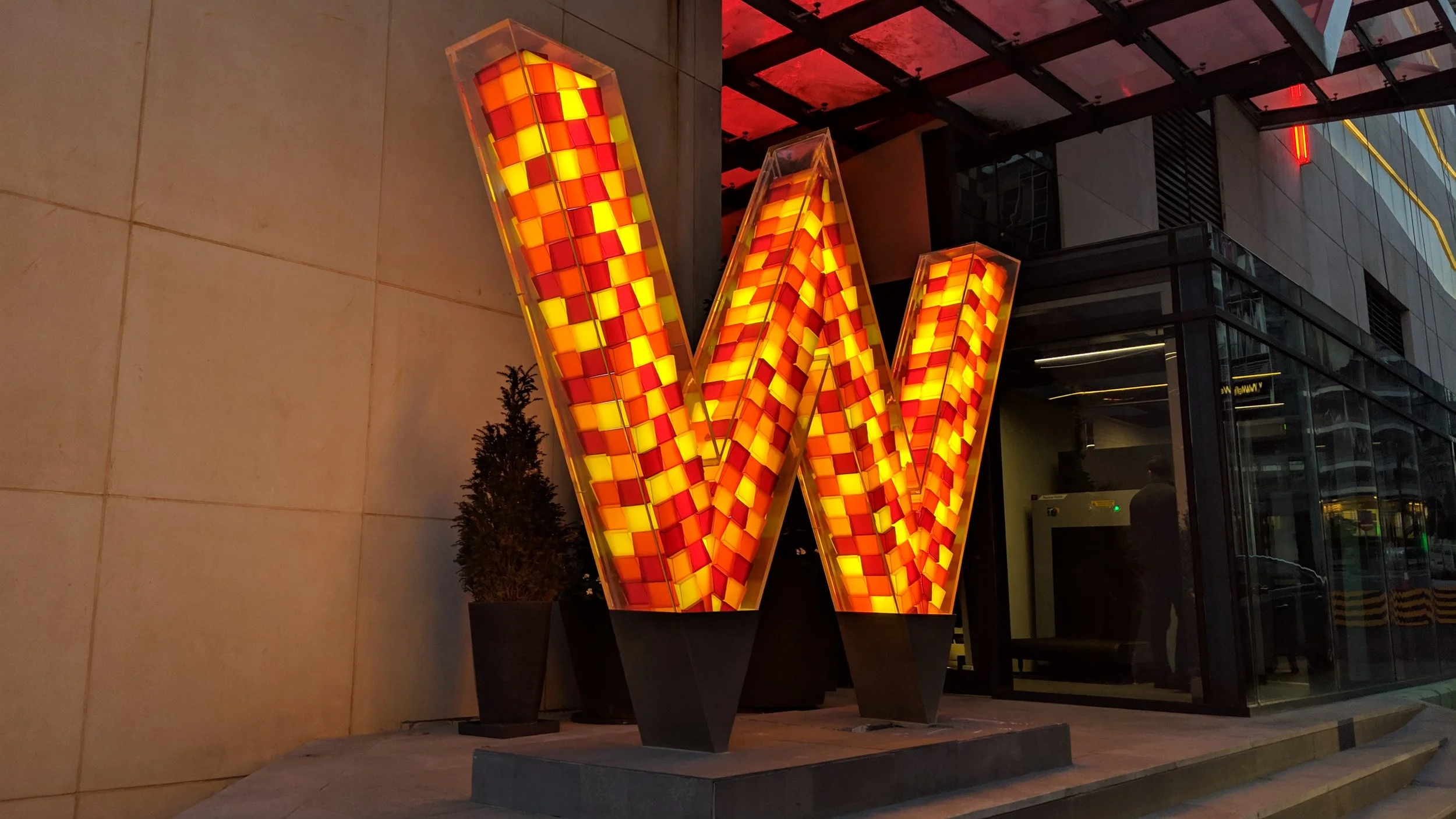 Logo / sign by the front entrance.