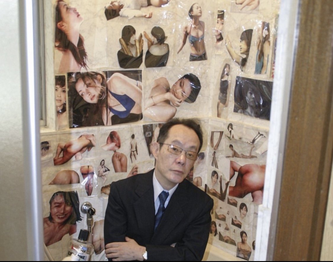 Sagawa photographed in his home. 