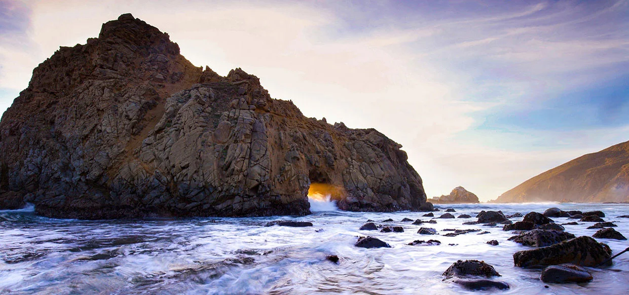 An ocean vista of swirling tide and craggy rocks