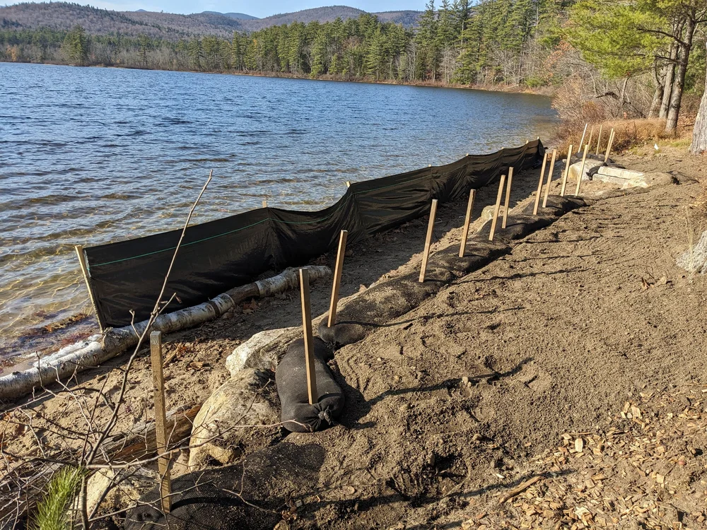 Various kinds of hardscaping with boulders and logs.