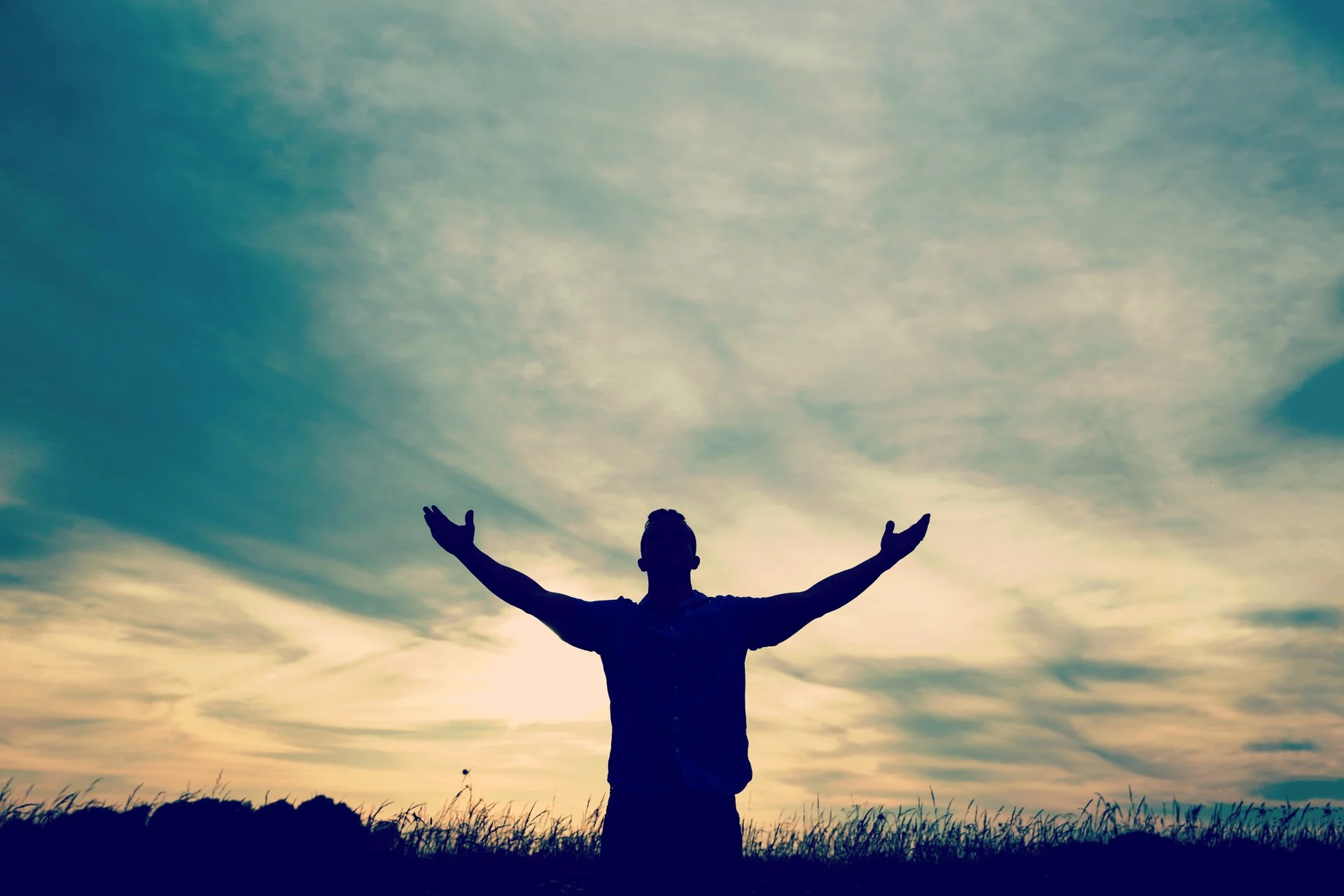 silhouette_of_a_man_with_open_arms-1920x1280.jpg