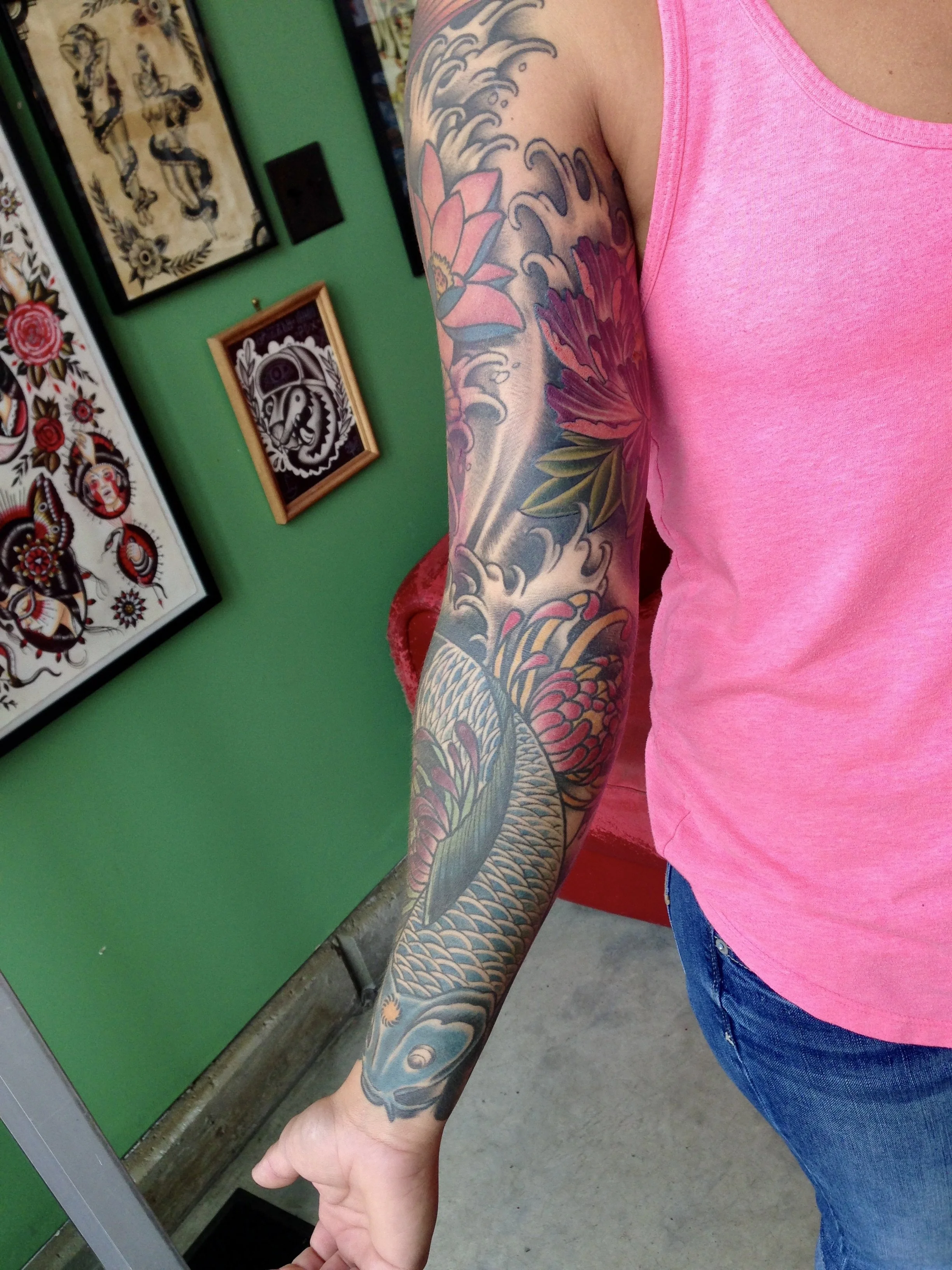 Healed Japanese koi fish sleeve tattoo.