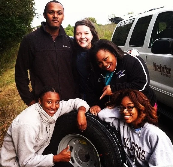 Students remain cheerful as Dr. Peterson panics about our tire blowout on I-40!