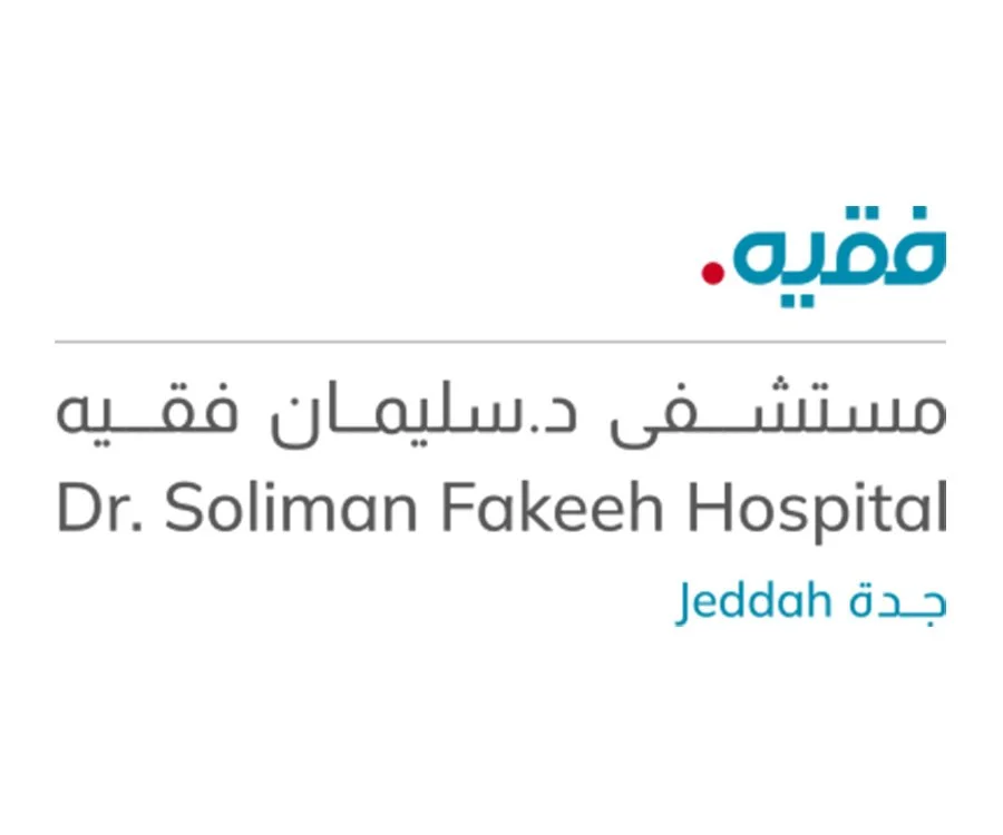 Signboard with Arabic and English text reading 'Qaboolie, Dr. Soliman Fakeeh Hospital, Jeddah'.