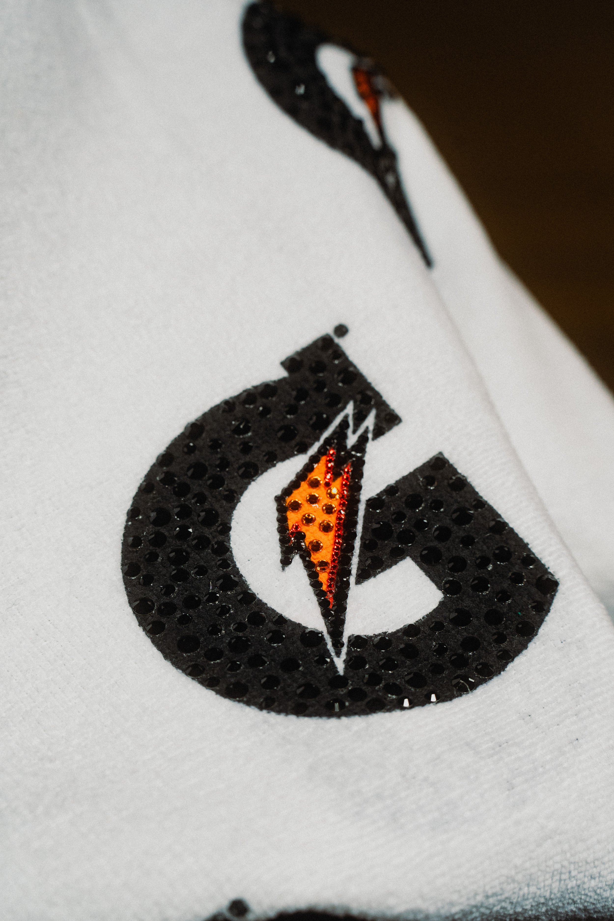 For Glo’s “Let Her Cook” performance at the All-Star game we created a custom-blinged-out-G bolt-towel-lined hoodie delivered in a custom Gatorade duffle