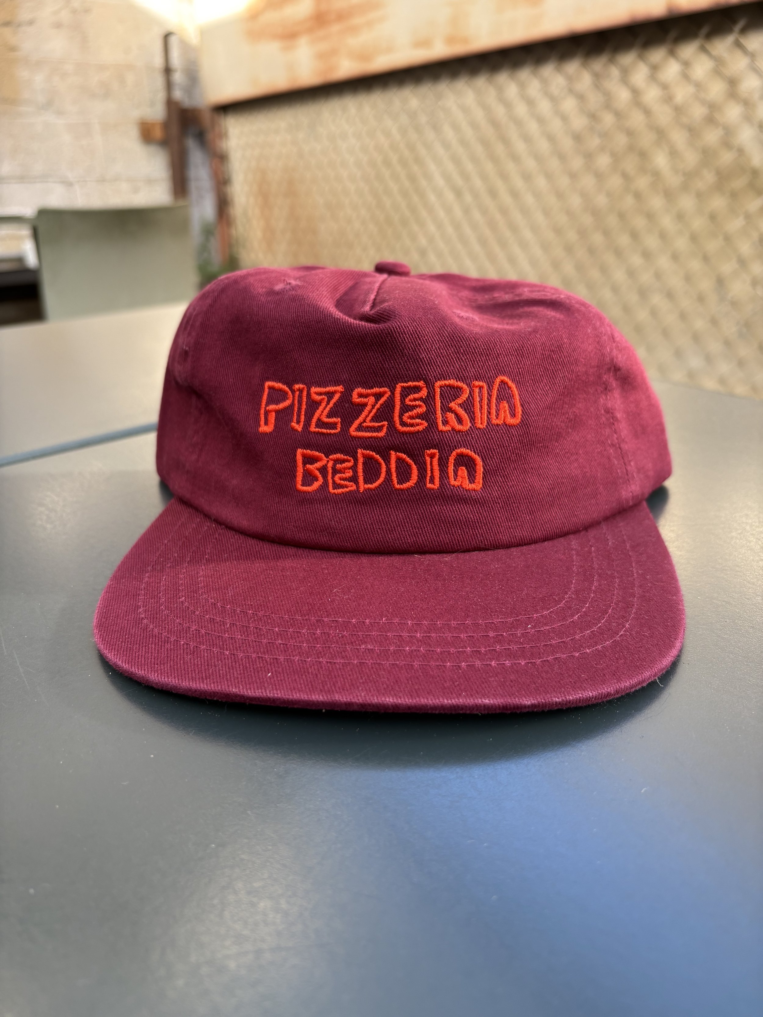 Wine Color Hat, Orange Writing.jpg