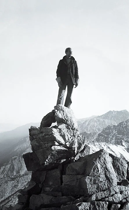 Fred Wilson, standing on a peak in the Sierra Nevada Mountains.