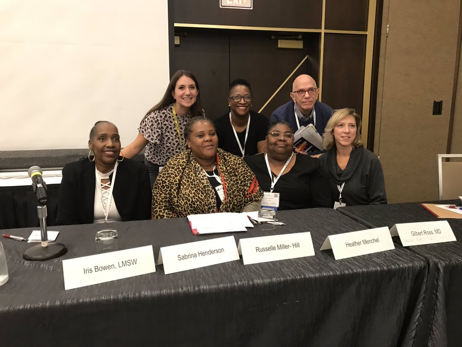 Rusti at a 2019 panel speaking about the needs of women in reentry