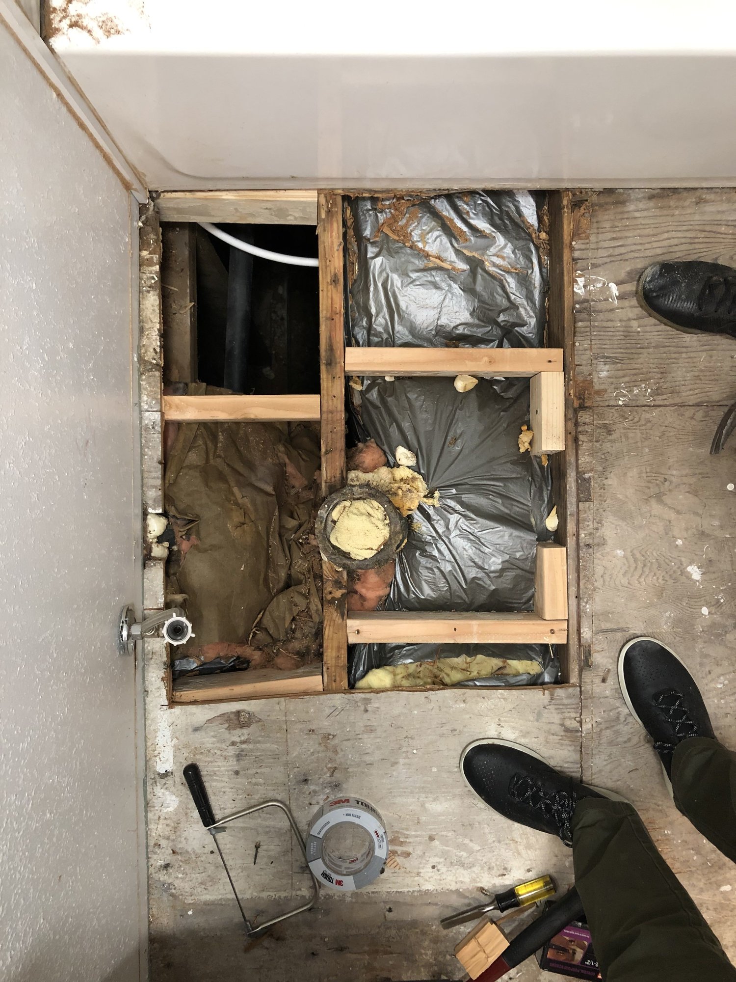 After we pulled the vinyl flooring up we cut out the square of subfloor that was rotted, added in two by fours to support the new subfloor, and added a new 3/4 inch piece of plywood for the subfloor .