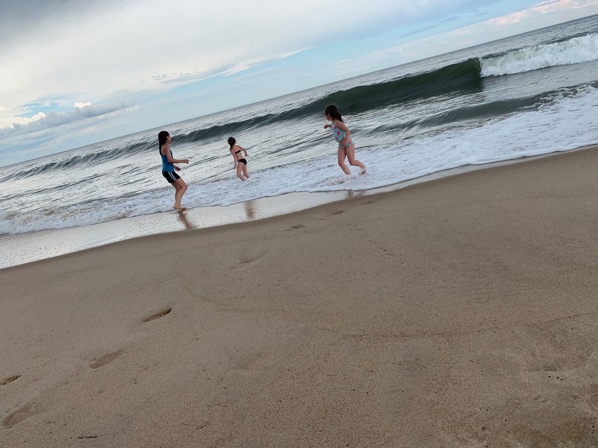 Jesse on beach w kids .jpeg