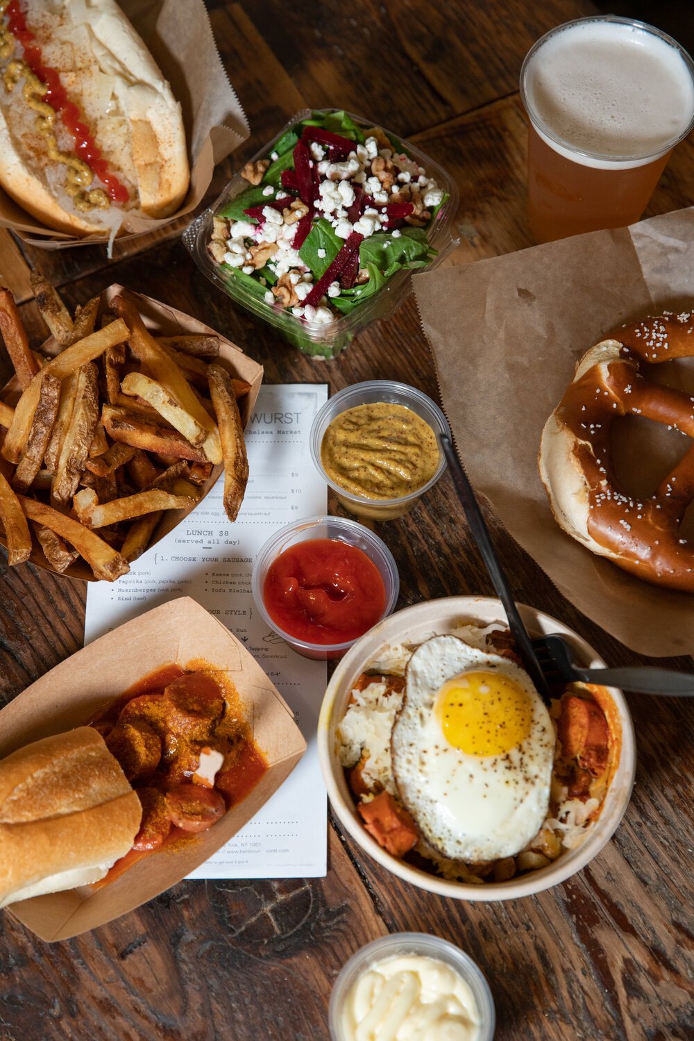 Overhead shot of food and beer on a table 
