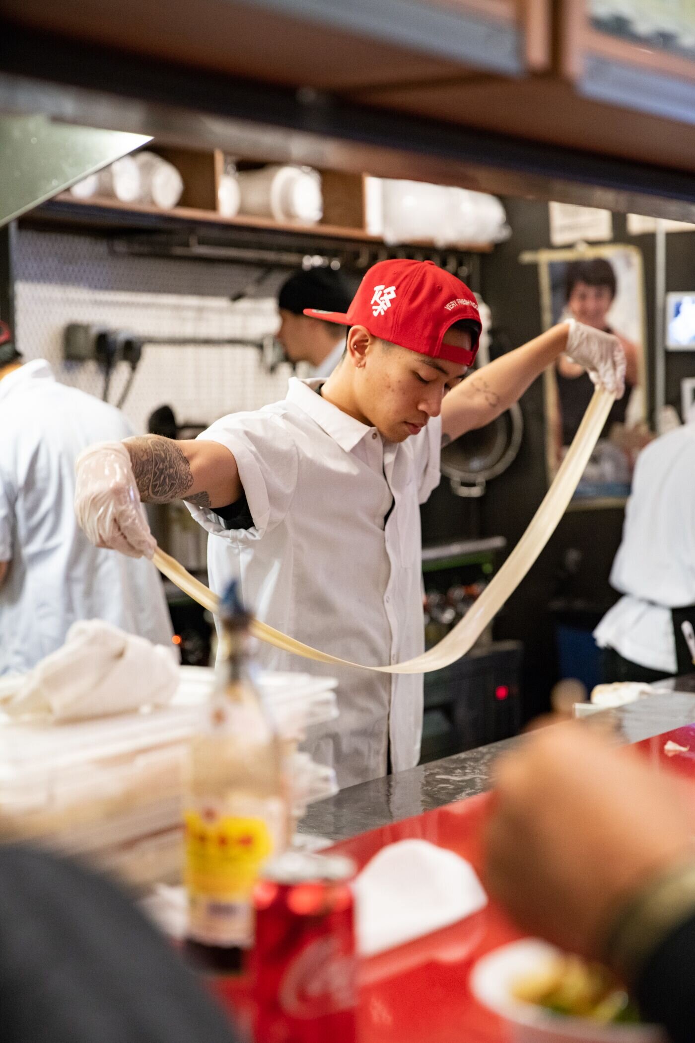 man hand pulling noodle