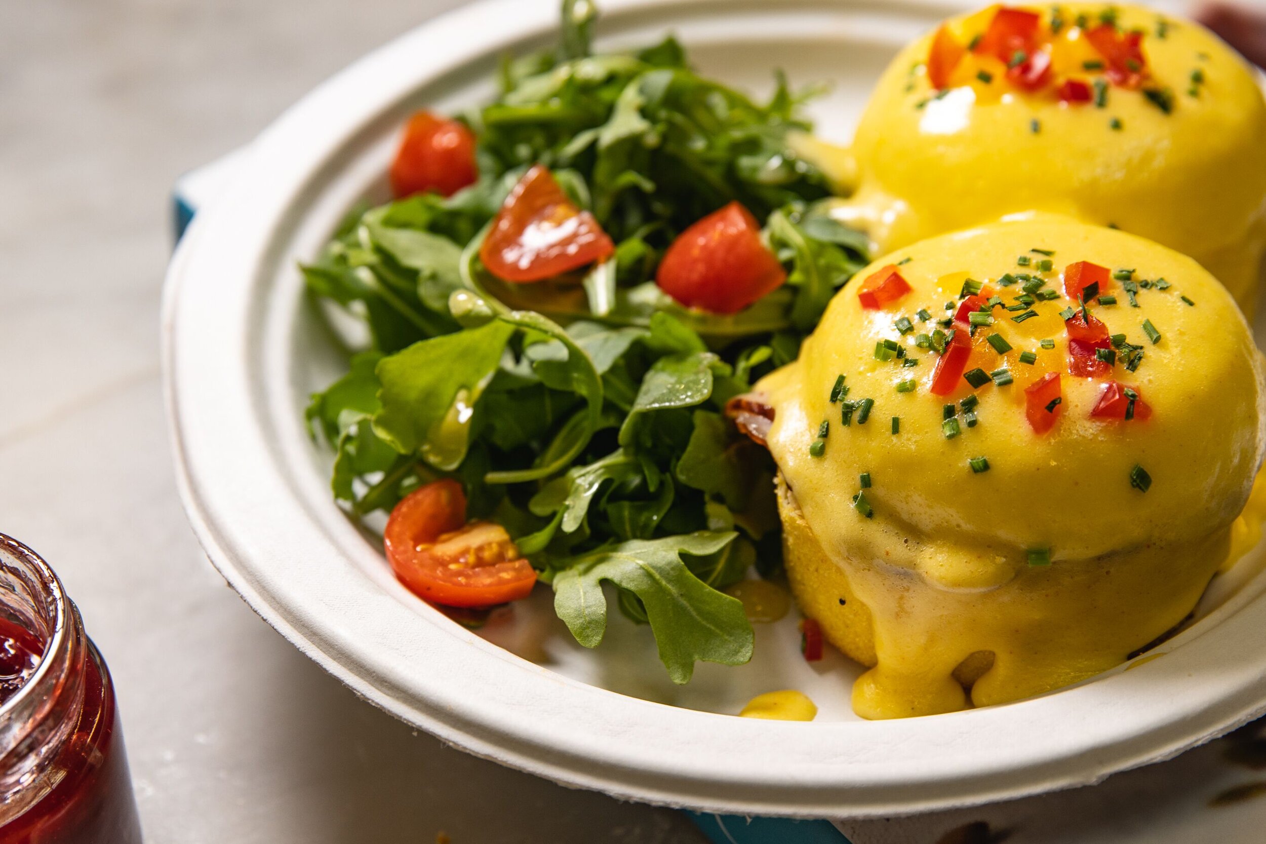 eggs Benedict with a side salad