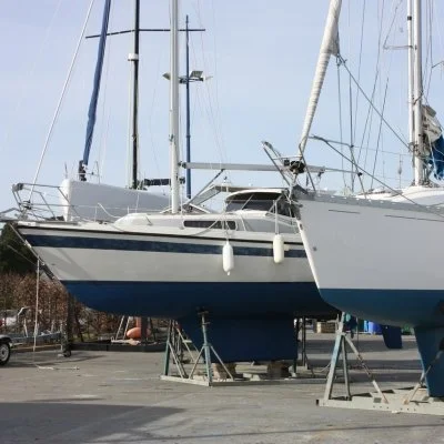 Boats stored on stands during routine marine maintenance
